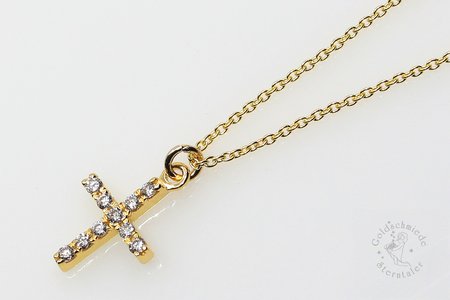 Halsschmuck aus Gold mit Kreuz und Brillanten